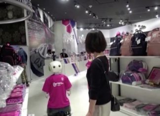Robot enforces mask-wearing, distancing at store in Japan